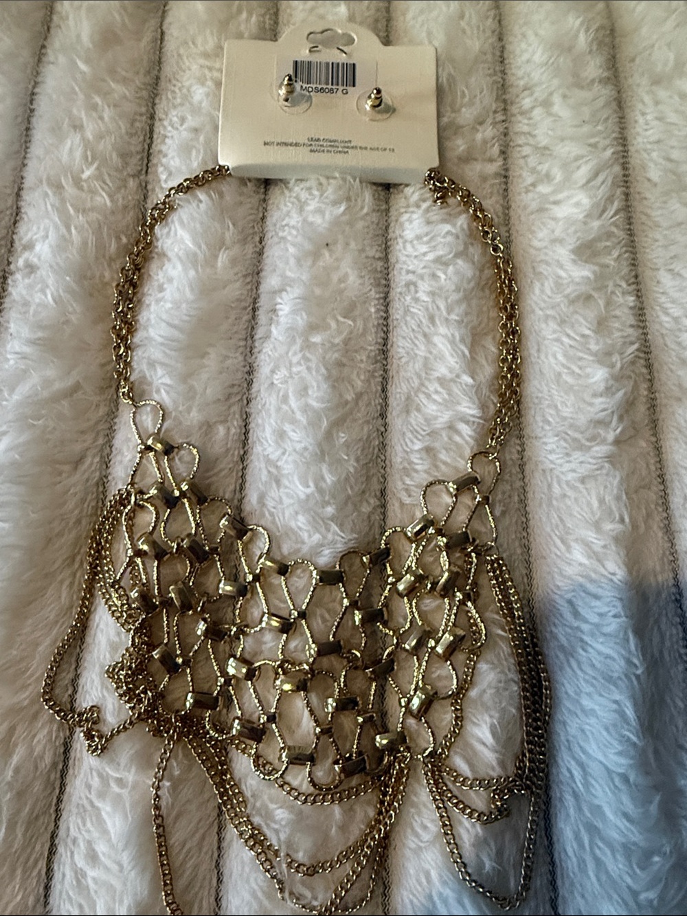 MIA COLLECTION Gold Multi-Chain Statement Necklace and earrings.